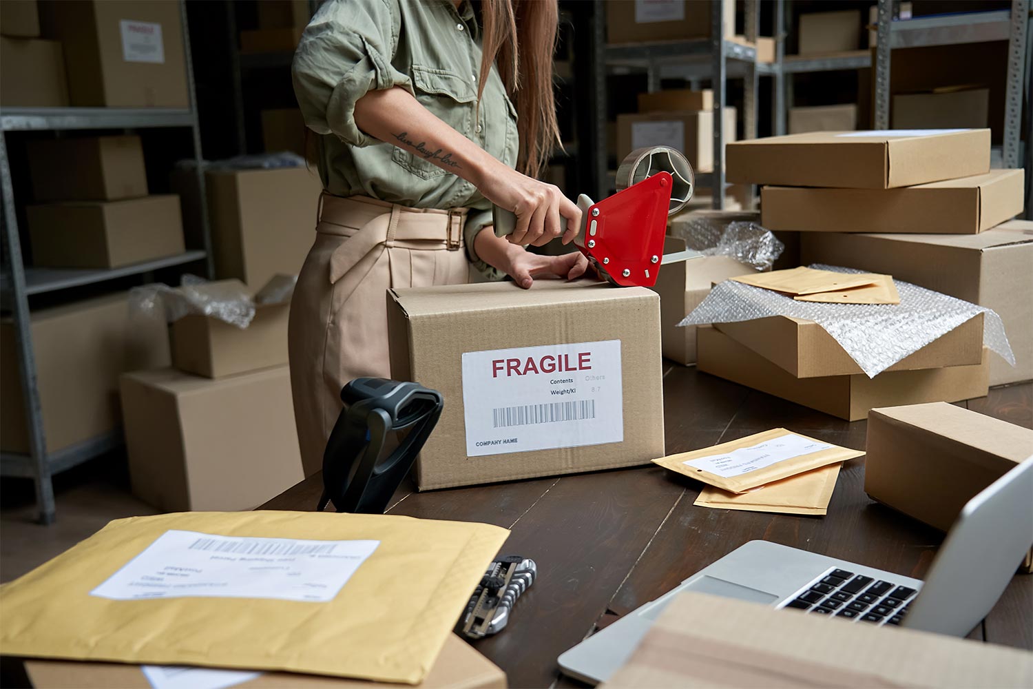 Sealing A Box Containing Fragile Items For Shipping